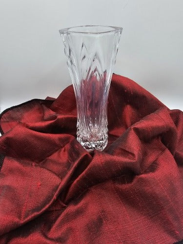 Glass vase positioned on Ruby Sheen red raw silk before wrapping