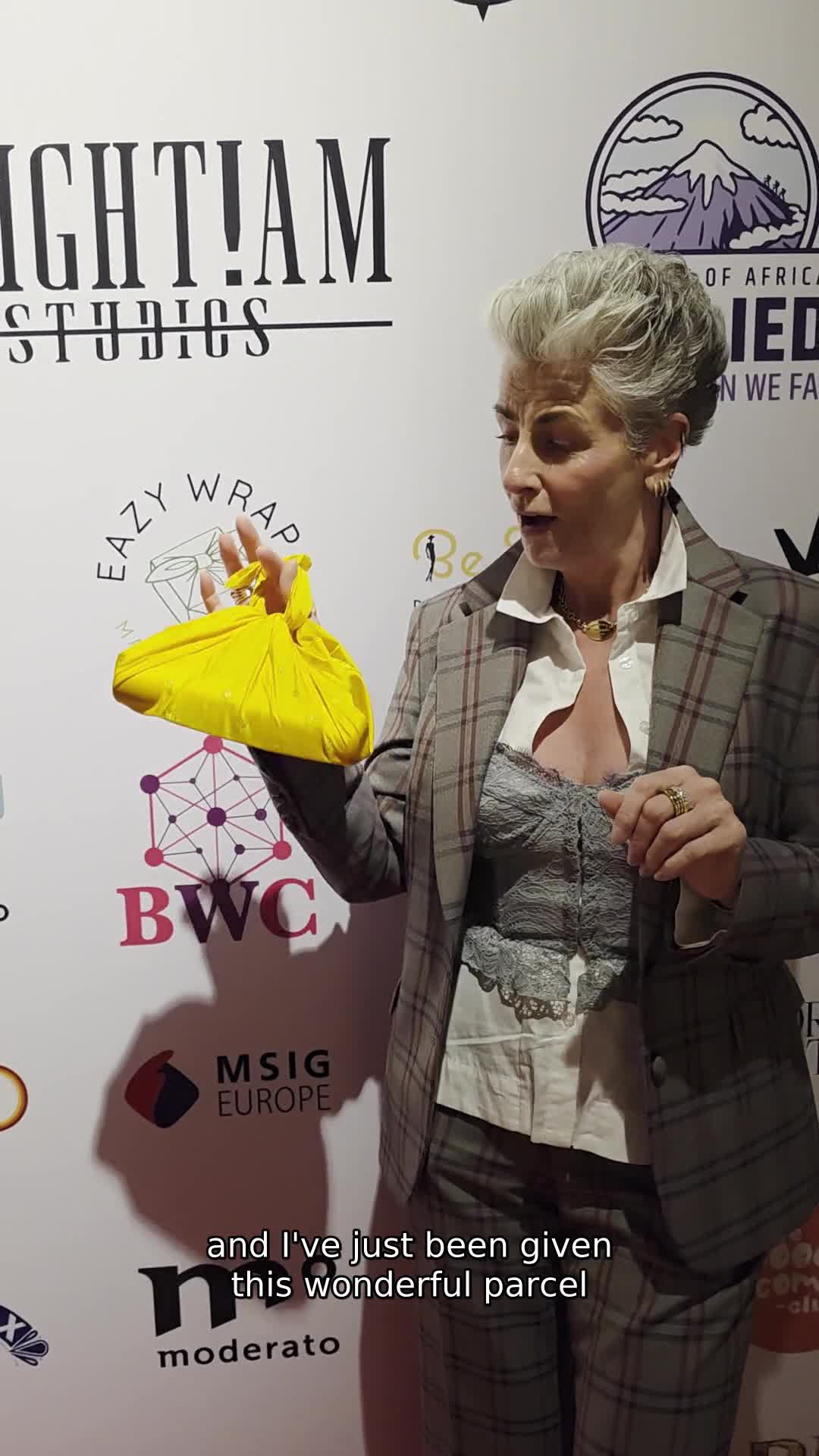 Maxine Laceby holding an Eazywrap at the film premiere