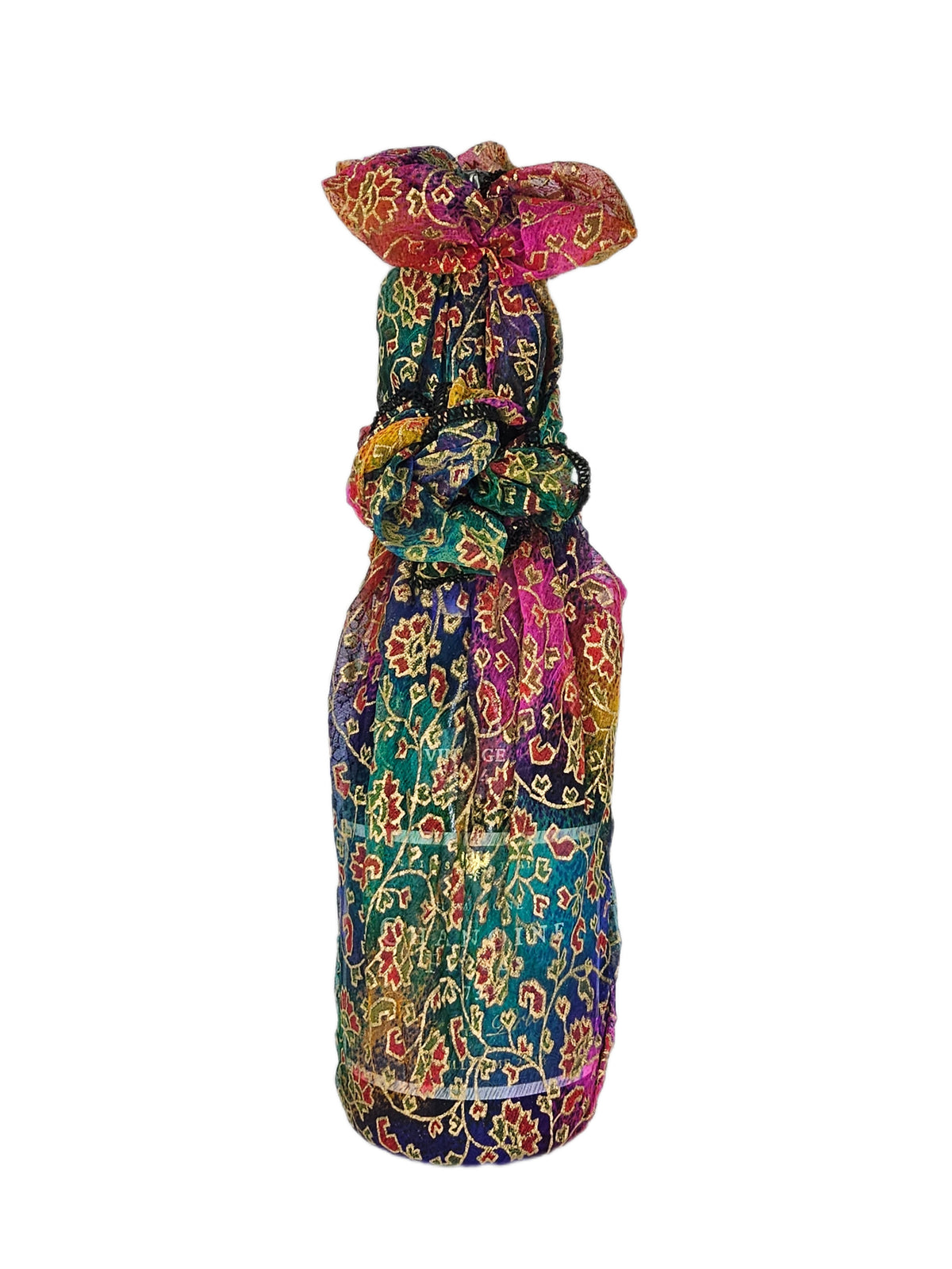 Rainbow Gold reusable fabric gift wrap tied around a bottle, showing the colourful leaf and floral print with gold detailing.