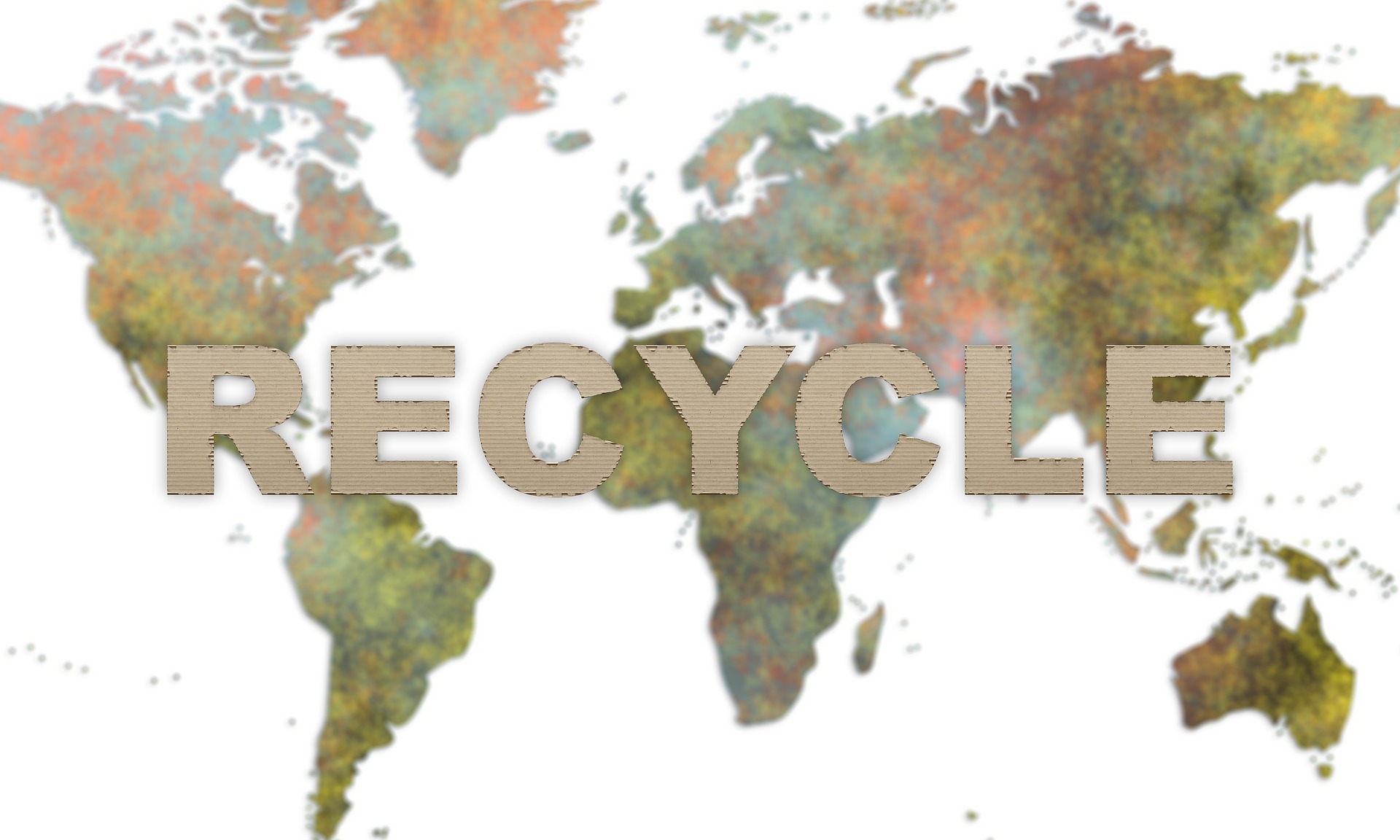 World map image with the word recycle across it 