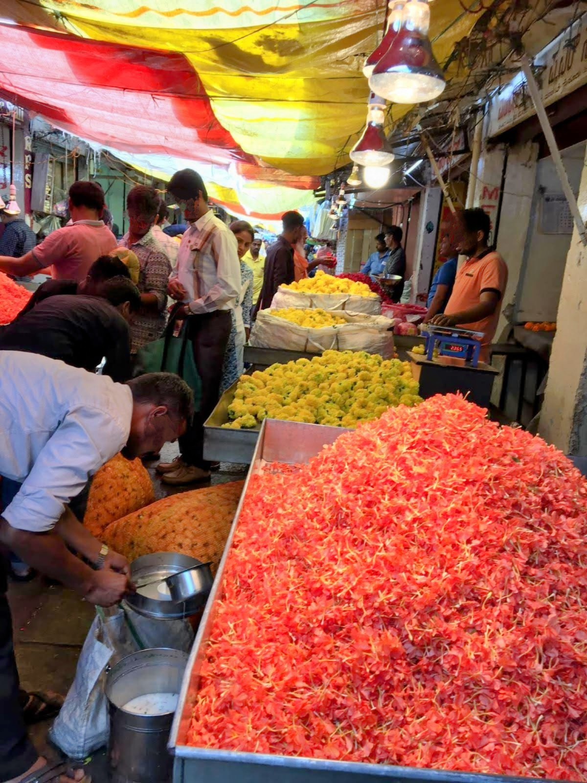 local market stalls with brightly coloured produce