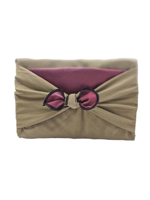 Green_coloured_silk_one_side_burgundy_colour_satin_the_other_side_fabric_gift_wrapping_around_a_rectangular_gift