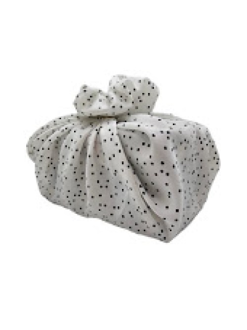 white_silky_fabric_gift_wrapping_with_black_polka_dots_wrapping_a_rectangular_boxed_gift3